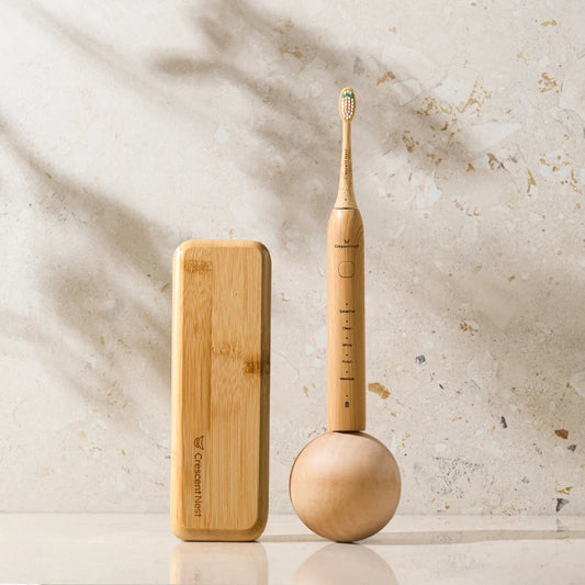 Crescent Nest Sustainable Sonic Electric Toothbrush paired with bamboo travel case – eco-friendly travel set