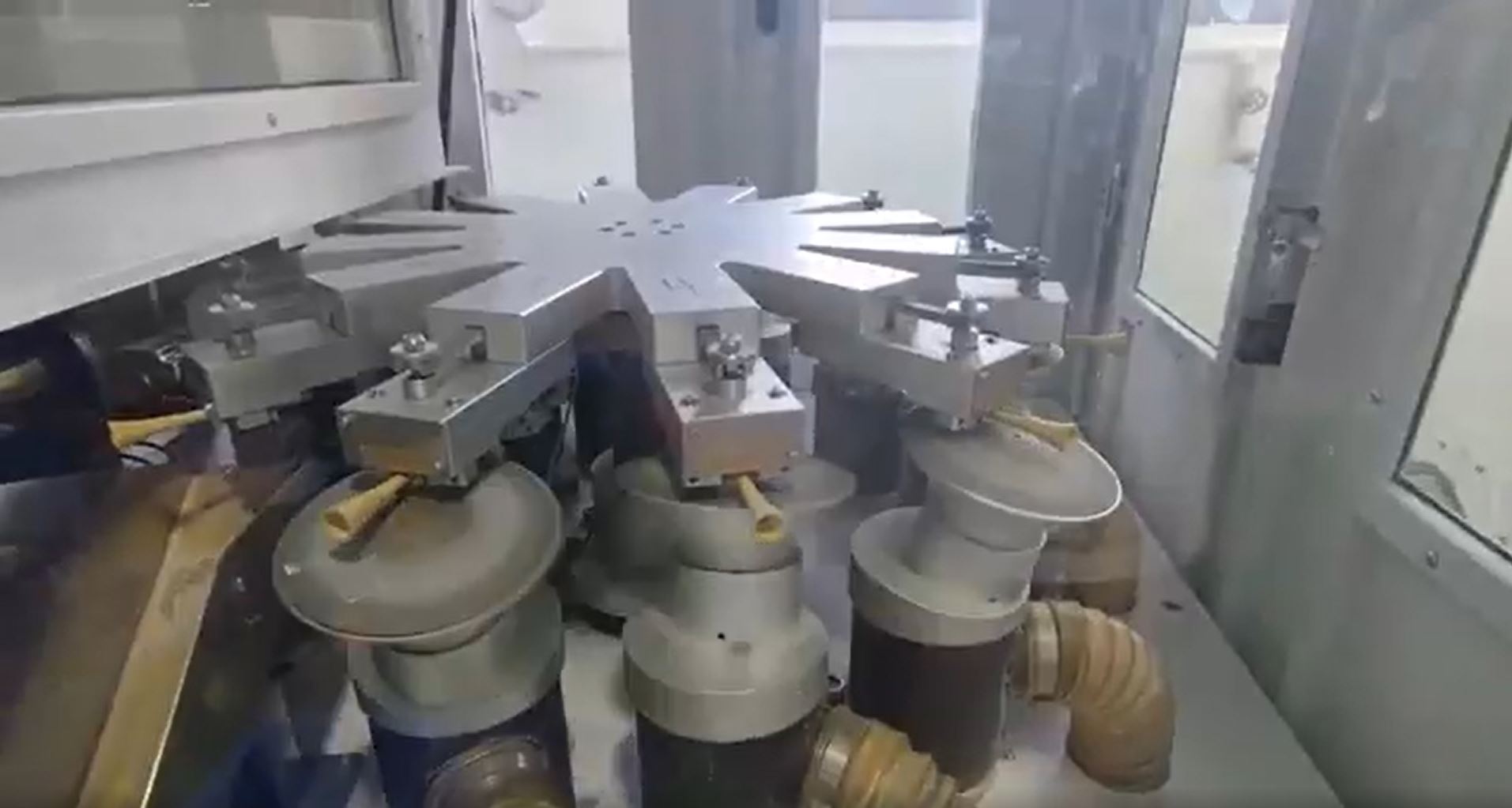 Load video: Footage of the Crescent Nest toothbrush being assembled in the factory, showing workers placing brush heads, inspecting components, and packaging the products for shipment.
