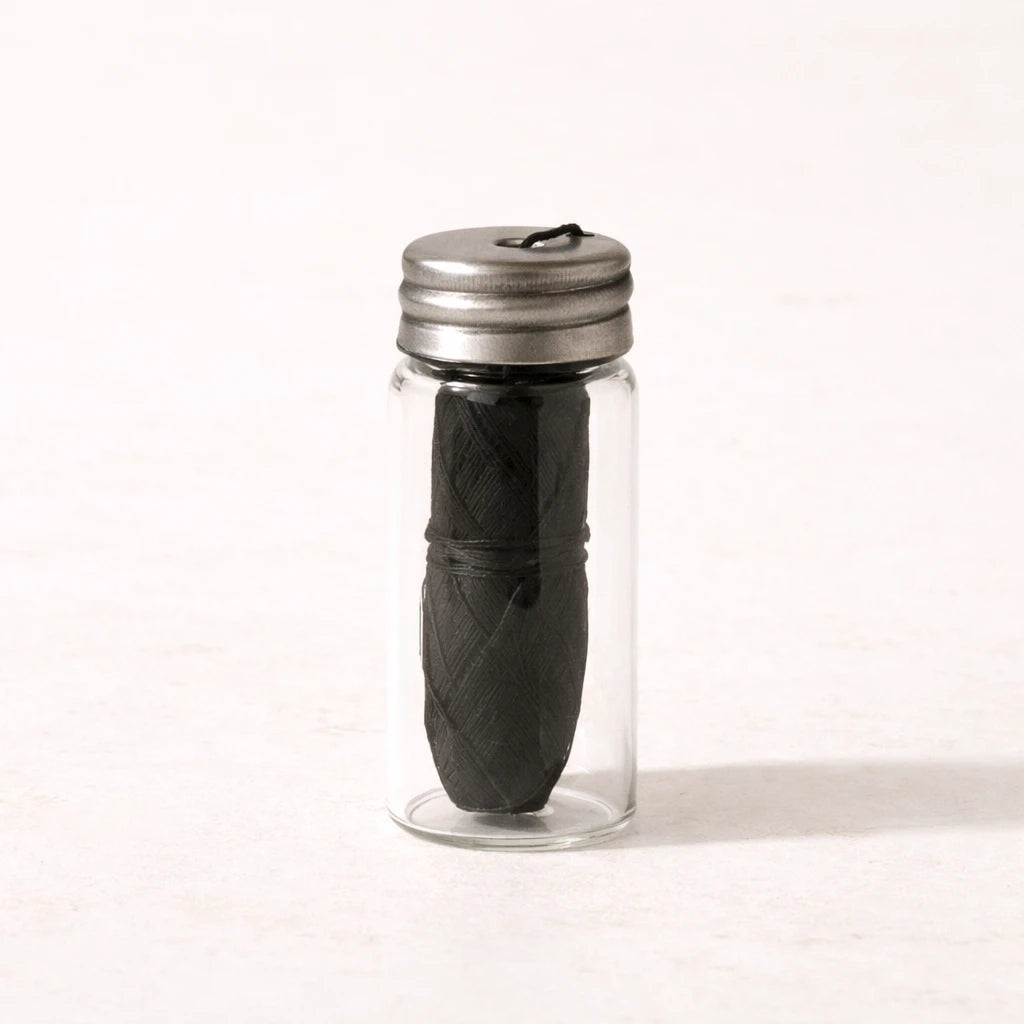 Crescent nest bamboo charcoal dental floss in glass jar