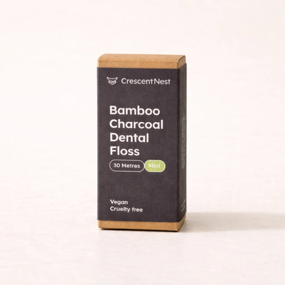 Box of Crescent Nest Bamboo Charcoal Dental Floss on a white background