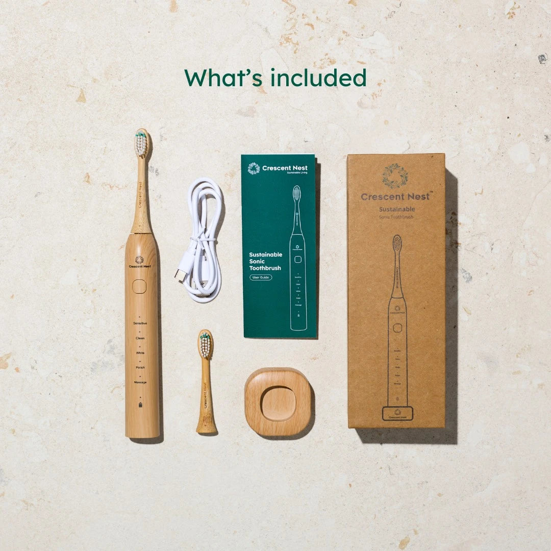Crescent Nest sustainable toothbrush set with packaging on a textured surface