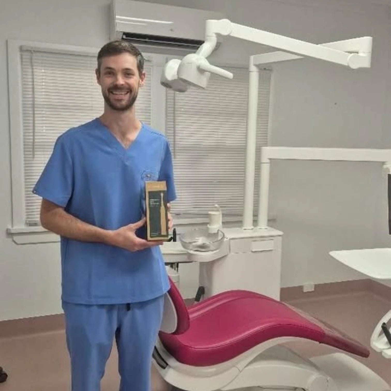 Dr Alexander McDonald, Functional Dentist at Vitality Functional Dental Australia, with Crescent Nest toothbrush