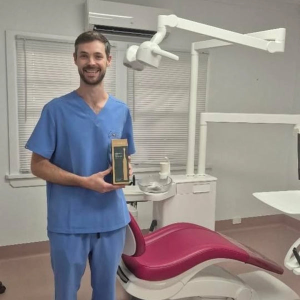 Dr Alexander McDonald, Functional Dentist at Vitality Functional Dental Australia, with Crescent Nest toothbrush