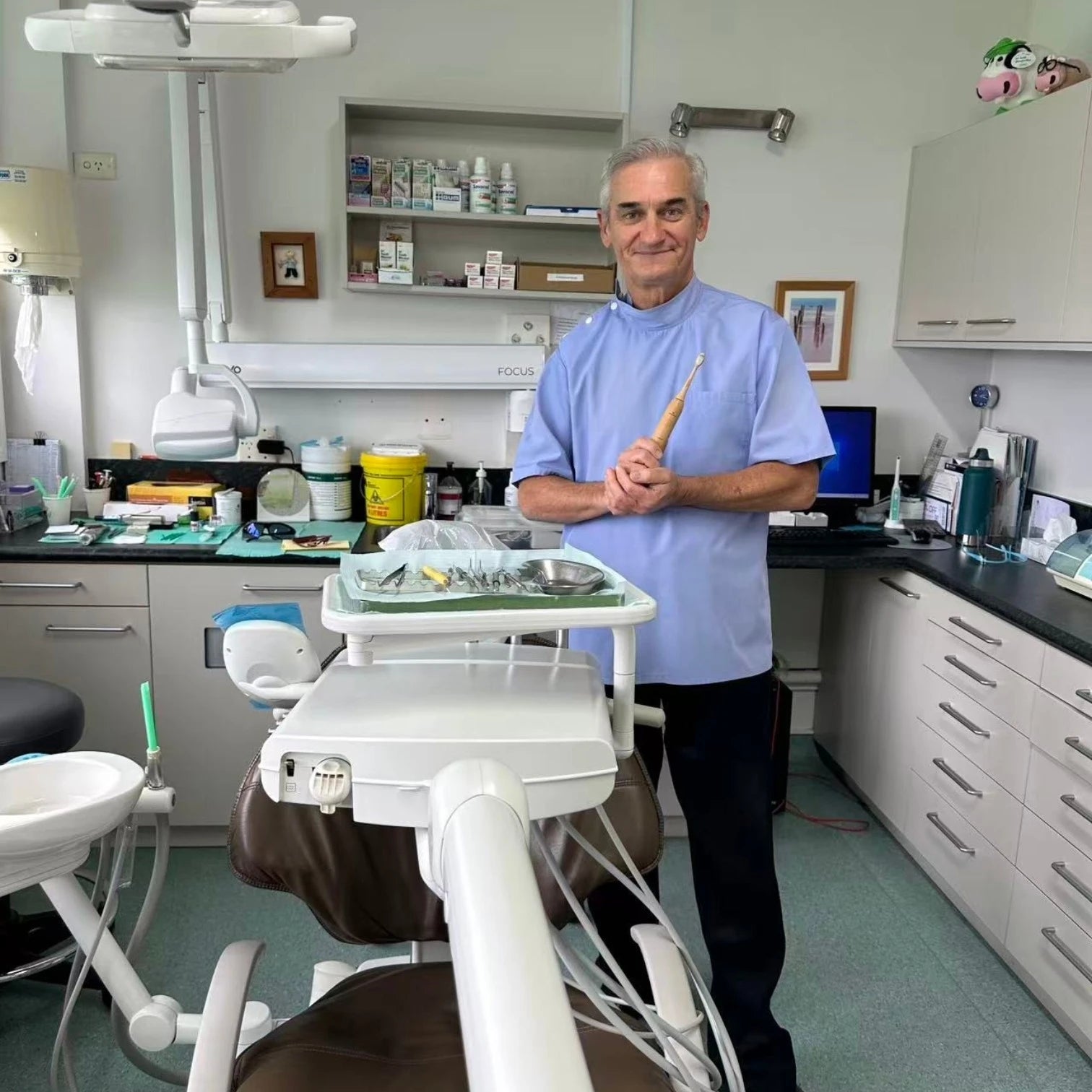Dr Glenn Dooley, General Dentist at Byron Dental Takapuna, with Crescent Nest toothbrush