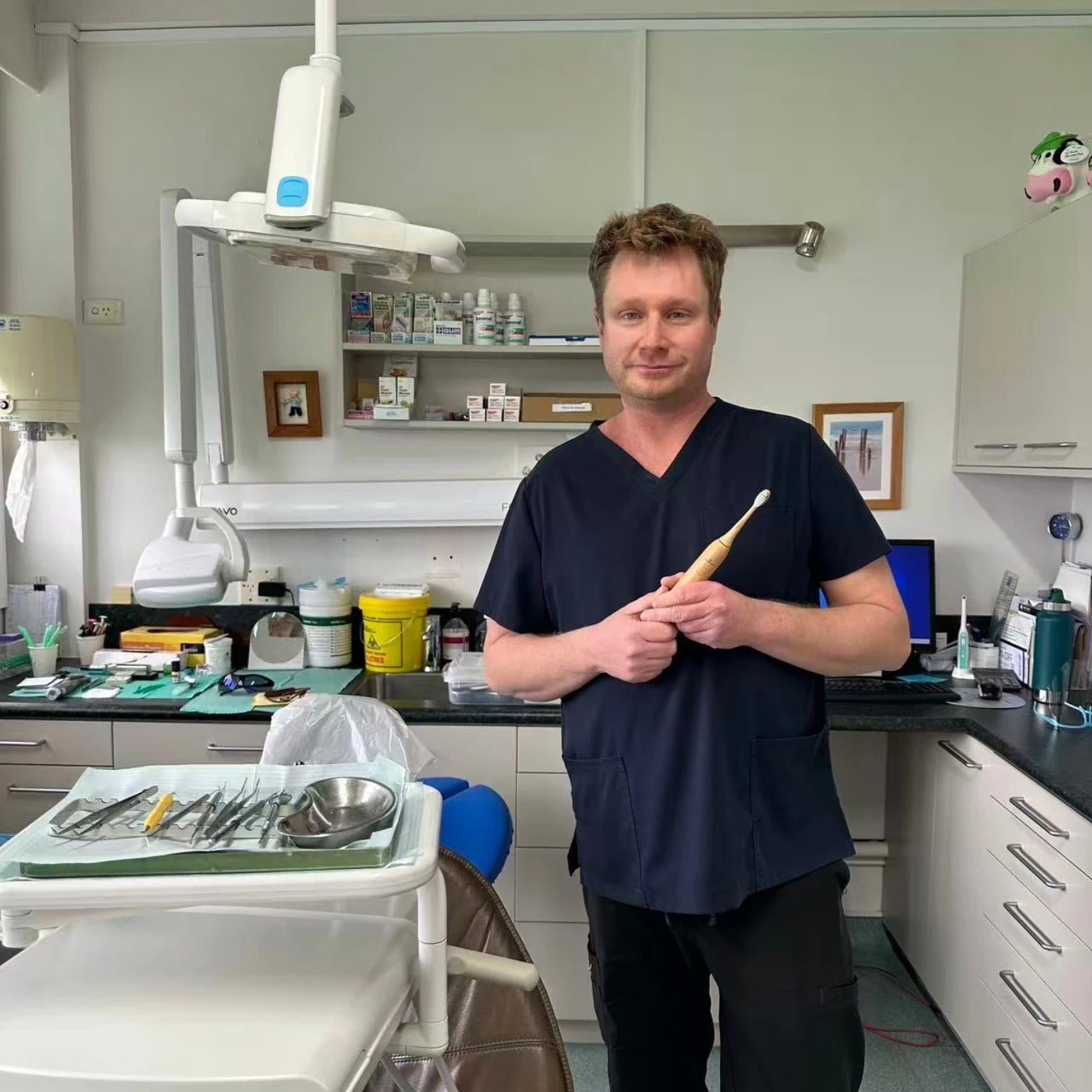 Dr Jason Mandle, General Dentist at Byron Dental Takapuna, with Crescent Nest toothbrush