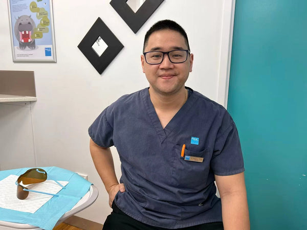 Dr Kaejenn Tchia, General Dentist, holding a Crescent Nest sonic toothbrush