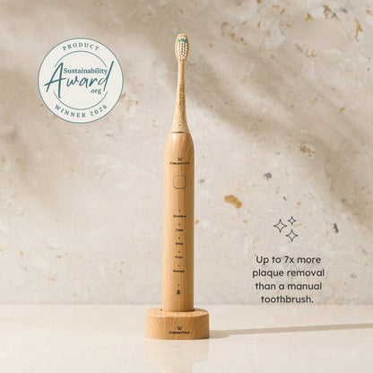 Bamboo electric toothbrush with sustainability award badge