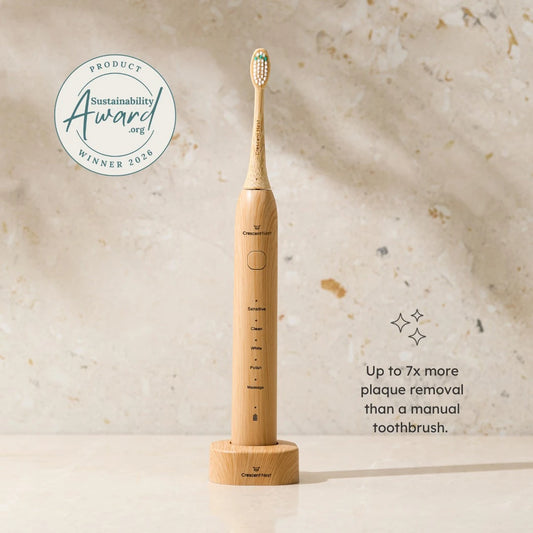 Bamboo electric toothbrush with sustainability award badge