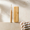 Bamboo travel case with Crescent Nest Sustainable Sonic Electric Toothbrush.