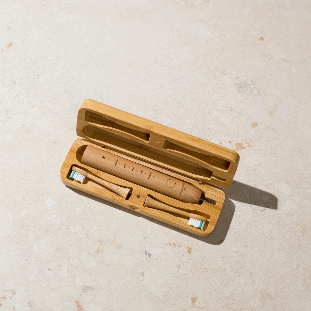 Open bamboo travel case showing natural interior and eco-friendly toothbrush storage.