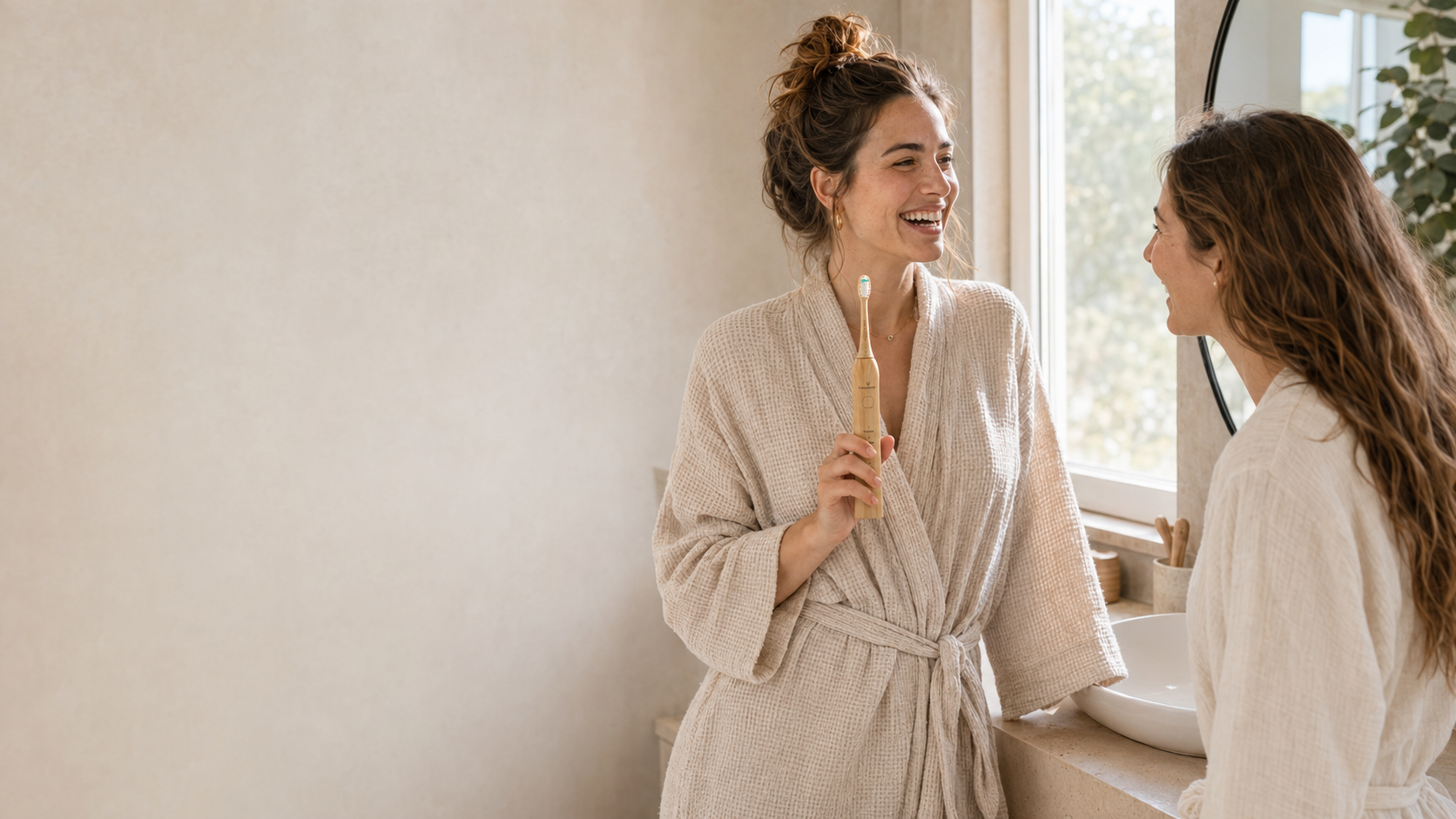 Two friends sharing a Crescent Nest sustainable sonic electric toothbrush