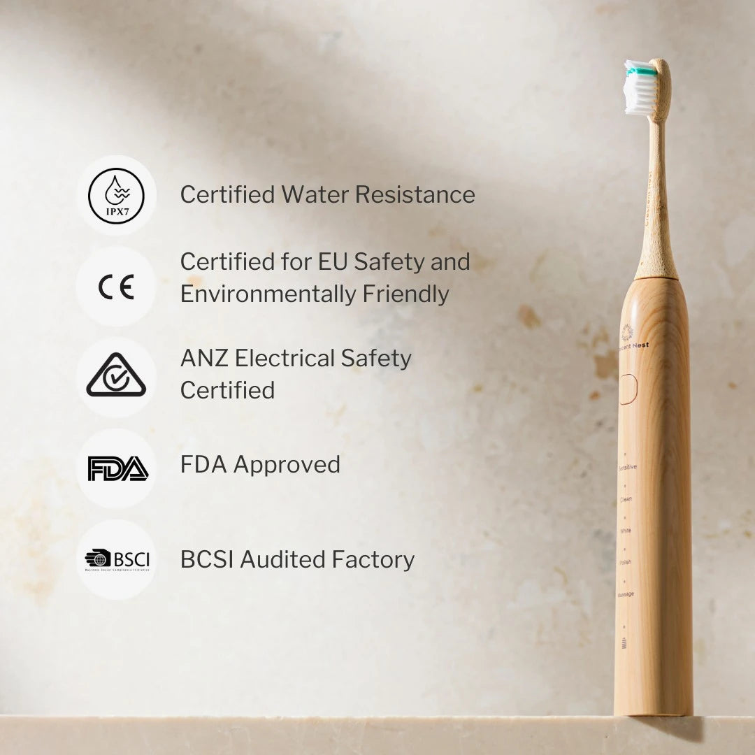Bamboo electric toothbrush with certification icons on a beige background