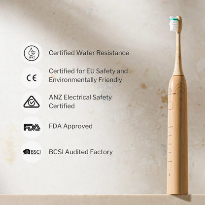 Bamboo electric toothbrush with certification icons on a beige background