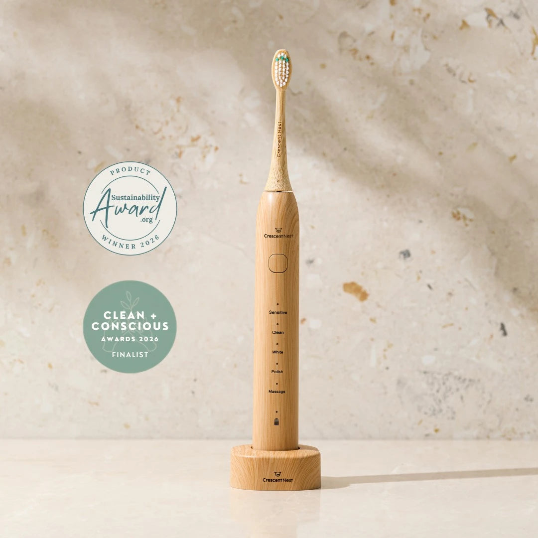 Crescent Nest award-winning sustainable sonic toothbrush with bamboo brush head and Clean + Conscious Awards finalist badge